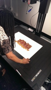 DLC staff member digitizes a textile fragment.
